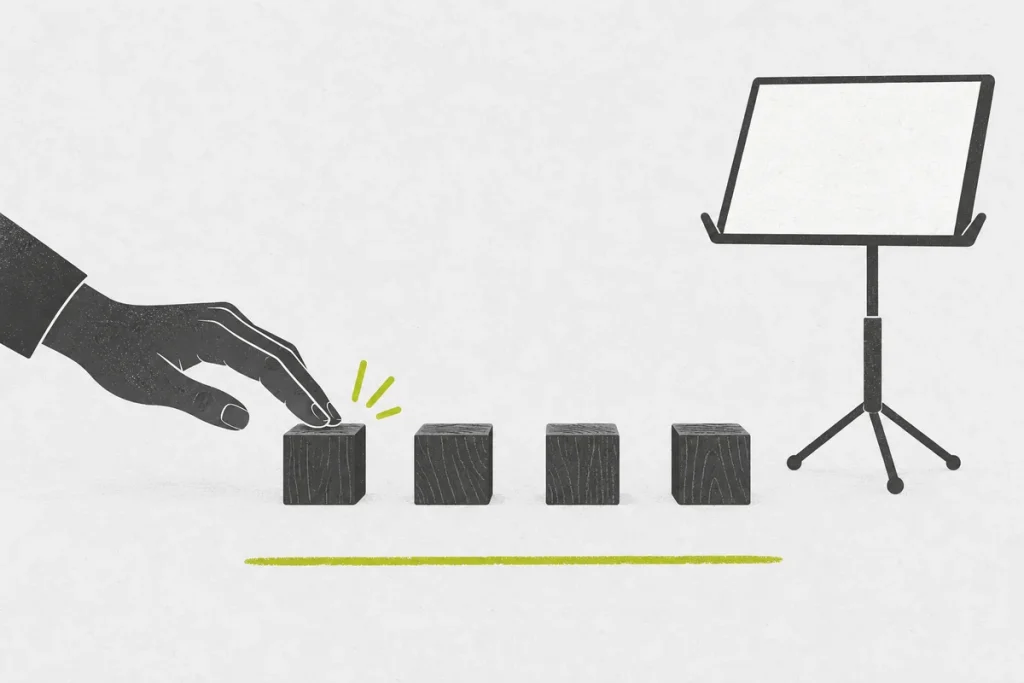 A hand tapping four evenly spaced blocks beside a blank music stand.